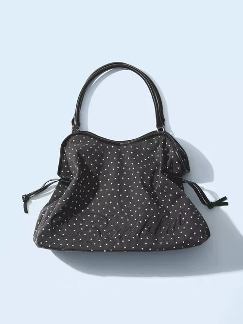 BadBlue, a Korean brand known for its niche, forest-inspired leopard print dot pattern, business-ready bag with a trendy, sweet-