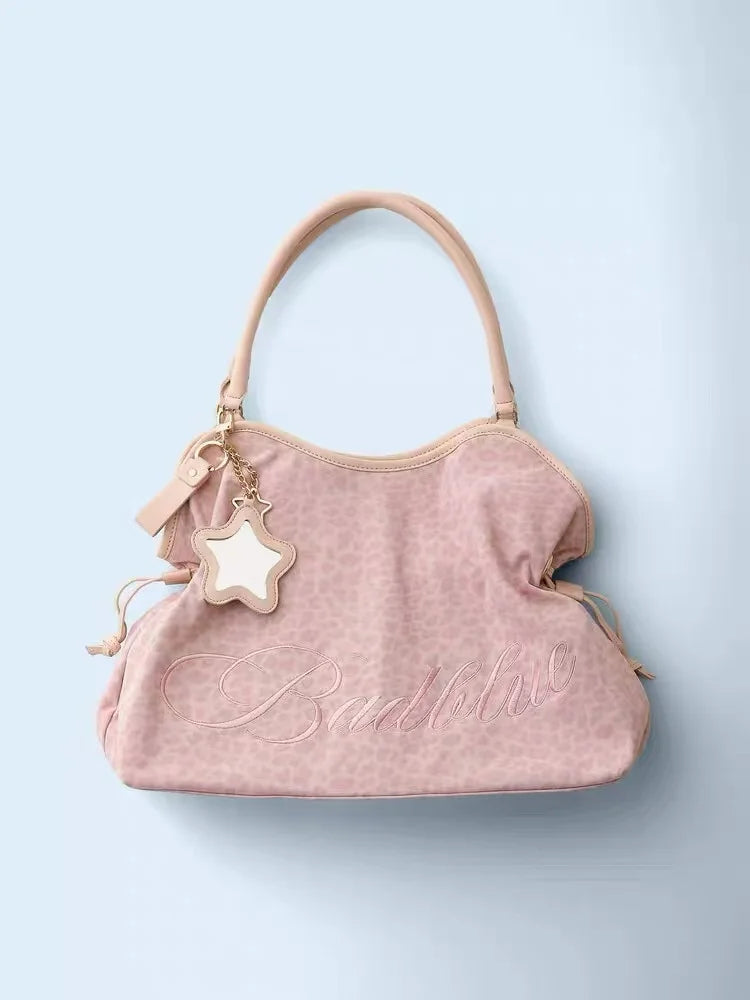 BadBlue, a Korean brand known for its niche, forest-inspired leopard print dot pattern, business-ready bag with a trendy, sweet-